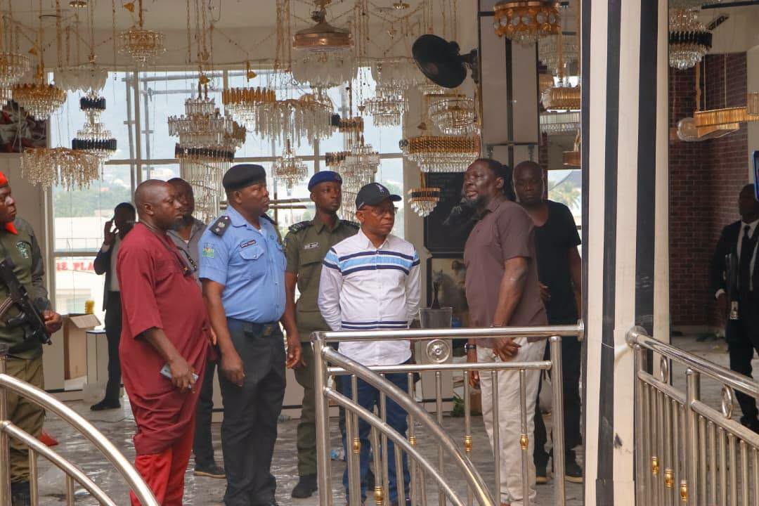 Governor Ododo assesses fire damage at PeeLinks Electronics in Lokoja